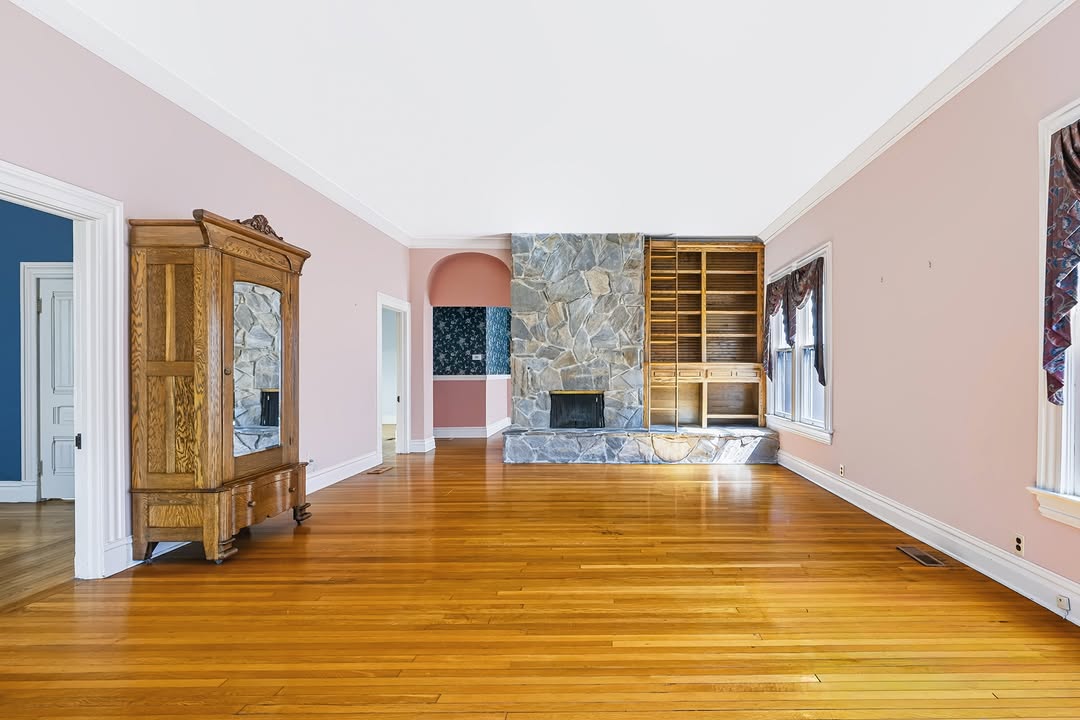 Living room with stone fireplace